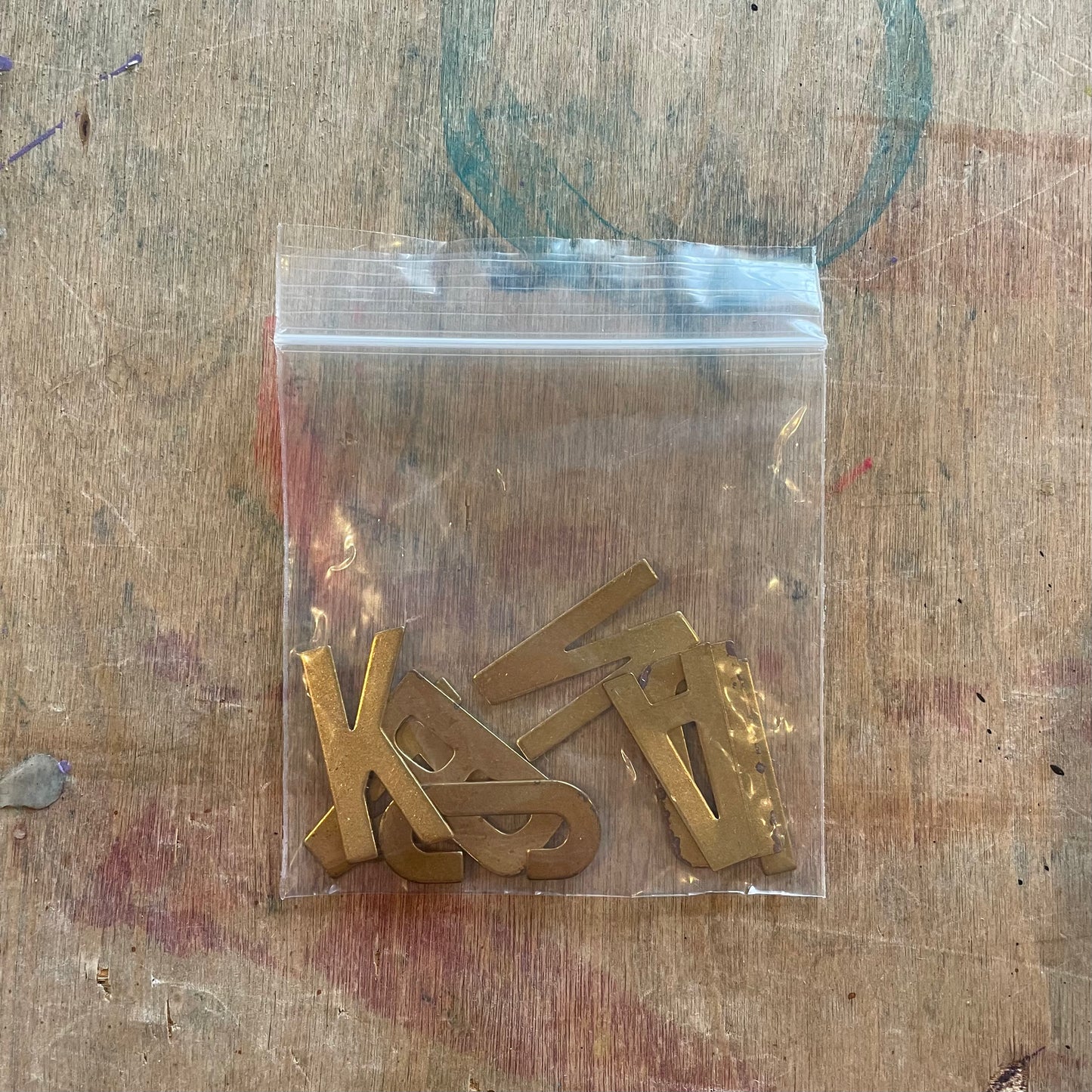 "LAND BACK" Brass Letter Charms Set