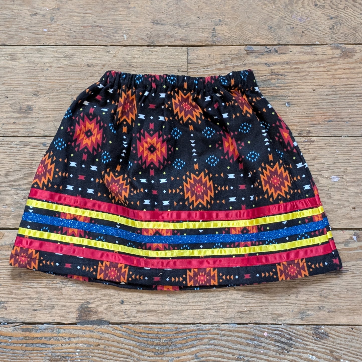 Black & Orange Fleece Baby Ribbon Skirt with Primary Stripes & Blue Glitter Accent