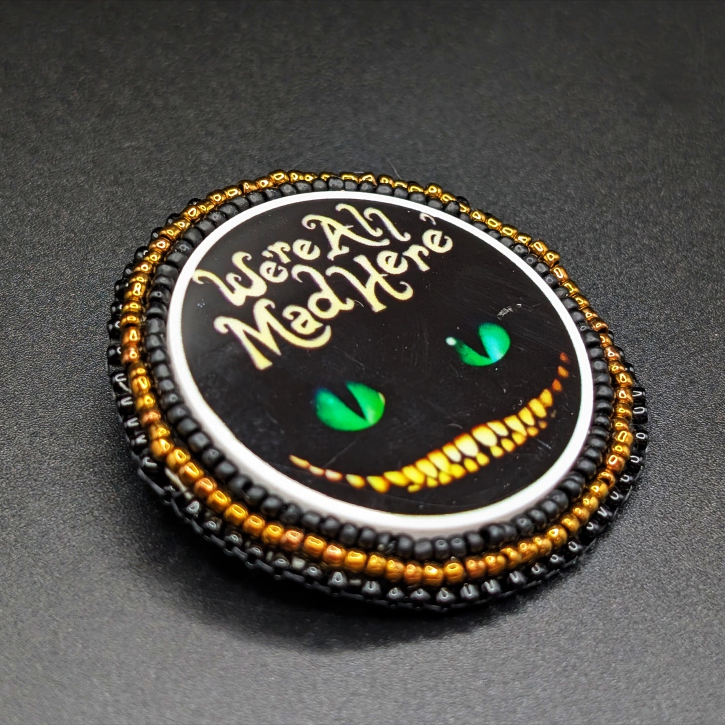 "We're All Mad Here" Black Cheshire Cat Beaded Brooch Pin