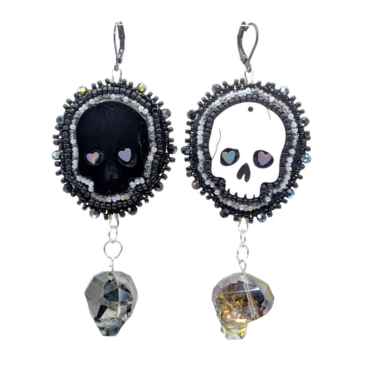 "Opposites Attract"  Skulls dangle