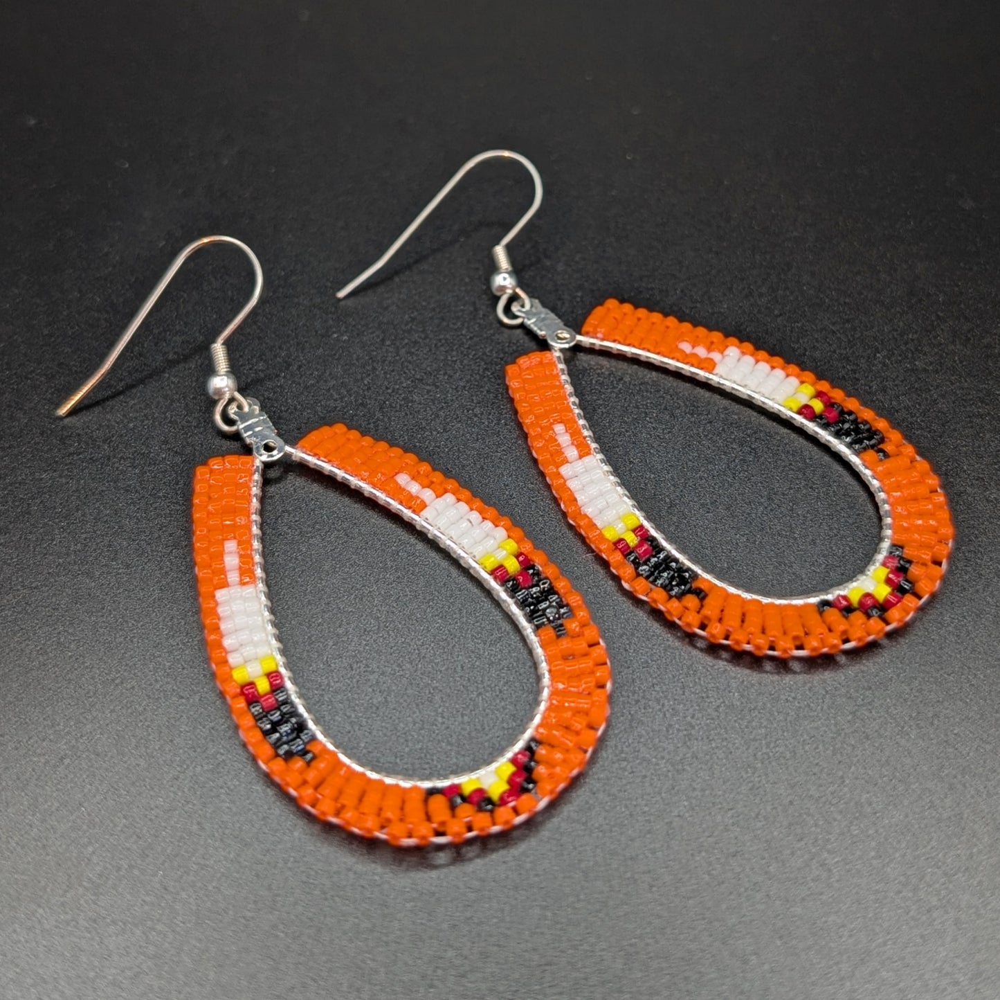 Orange Beaded Tear Drop Dangling Earrings with Feather Motif