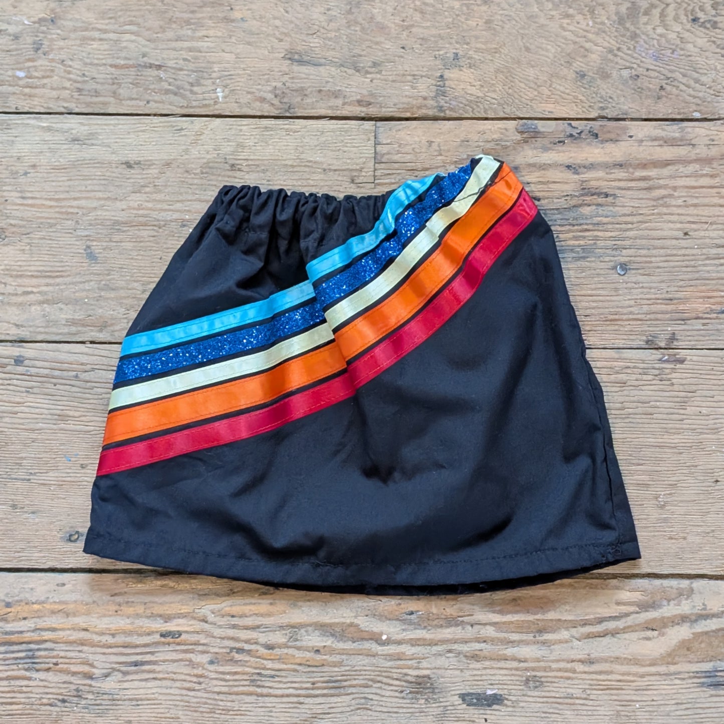 Black Baby Ribbon Skirt with Diagonal Stripes & Blue Glitter Accent